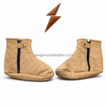 Beige quilted leather bootie slippers with diamond stitching, soft leather texture, ankle-height shape, and clean product presentation.