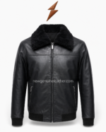 Black shearling jacket shown open with smooth black lining, silver zipper hardware, faux fur collar, and ribbed waistband.