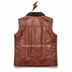 Cognac brown shearling leather vest with dark plush collar, brass buttons, flap chest pockets, and stitched leather panel design