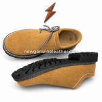 Oktoberfest suede shoes showing low-cut collar, patterned laces, camel upper, white stitching, black rugged