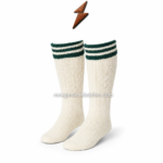 Cream lederhosen socks with green striped cuff and ribbed knit texture on white studio background