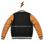 Custom varsity jacket open-front view with black quilted lining, tan printed sleeves, full zipper, and angled pocket trim