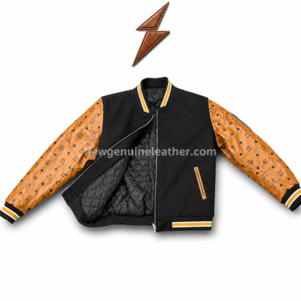 Custom varsity jacket in black and tan colorway with patterned leather-look sleeves, silver zipper, rib cuffs