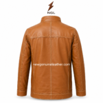Tan moto jacket with stand collar, full front zipper, two chest zipper pockets, side hand pockets, and contrast stitching.