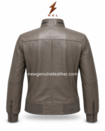 Taupe bomber jacket back pose with vertical panel stitching, rib-knit hem, sleeve seams, and NGL
