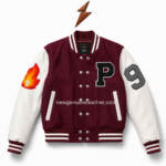 Back view of women’s patch varsity jacket with maroon body, cream sleeves, striped rib hem, sleeve number patch, and clean panel stitching.
