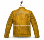 Yellow cafe racer jacket detail showing cracked leather texture, double chest zipper pockets, flap pocket, black zipper, and reinforced stitching.