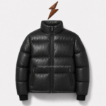 Best puffer jacket showing black padded channels, slanted zipper pockets, rib-knit cuffs, and a branded sleeve patch