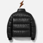 Open best puffer jacket with glossy black leather panels, silver center zipper, dark lining, and branded inner collar