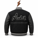 Black varsity jacket with leather sleeves, white striped rib trim, and back script embroidery