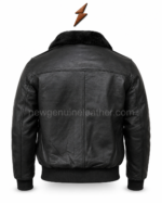 Black shearling bomber jacket rear view showing shoulder yoke, central back seam, ribbed hem, stitched sleeves, and newgenuineleather.com branding