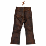 NGL distressed leather pants with brown waistband, belt loops, metal button, coin pocket, and curved front pockets