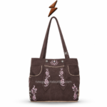 NGL Lederhosen bag showing cream flower and leaf stitching across the curved warm-brown front flap
